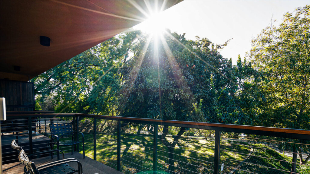 Balcony view with sun flare