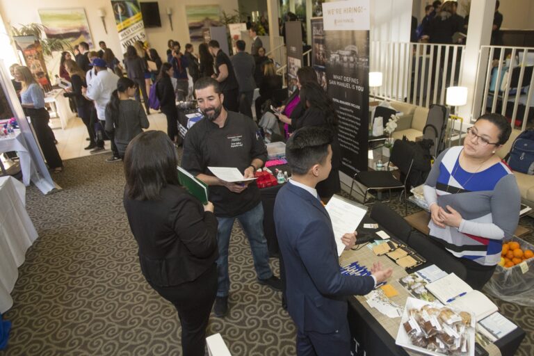 career fair recruiters talk with students