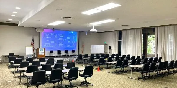 auditorium setup for meeting with projector screen