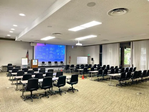 auditorium setup for meeting with projector screen