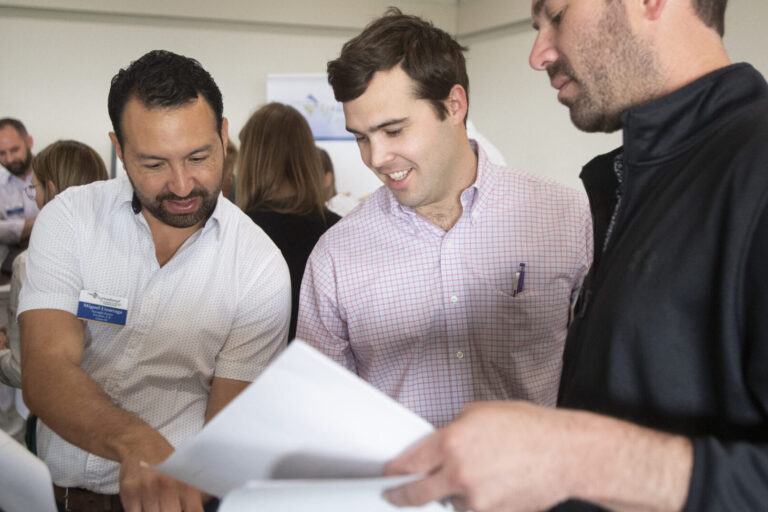 Three business men at a meeting