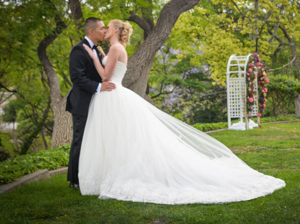 bride and groom kiss at Kellogg West outdoor wedding