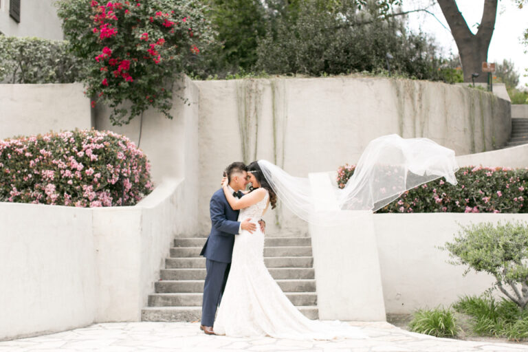 bride and groom embrace at Kellogg House
