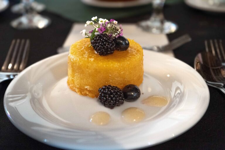 olive oil cake topped with blackberries